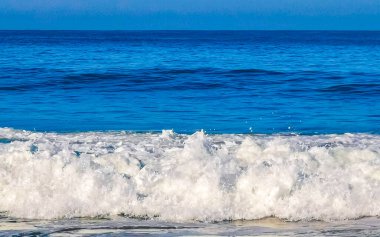 Extremely huge big powerful surfer waves on the beach in Zicatela Puerto Escondido Oaxaca Mexico.