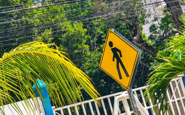 Yellow pedestrian sign street sign in Playa del Carmen Quintana Roo Mexico.