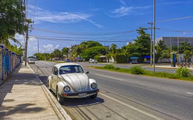 Playa del Carmen in Quintana Roo Mexico 12. July 2021 Typical street road and cityscape with cars traffic restaurants shops stores people and buildings of Playa del Carmen in Quintana Roo Mexico.