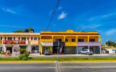 Playa del Carmen in Quintana Roo Mexico 12. July 2021 Typical street road and cityscape with cars traffic restaurants shops stores people and buildings of Playa del Carmen in Quintana Roo Mexico.