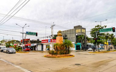 Playa del Carmen in Quintana Roo Mexico 15. June 2021 Typical street road and cityscape with cars traffic restaurants shops stores people and buildings of Playa del Carmen in Quintana Roo Mexico.
