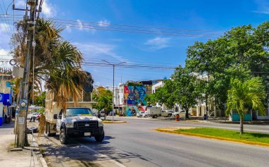 Playa del Carmen in Quintana Roo Mexico 12. July 2021 Typical street road and cityscape with cars traffic restaurants shops stores people and buildings of Playa del Carmen in Quintana Roo Mexico.
