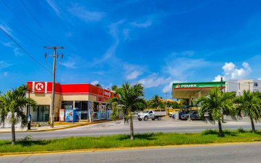 Playa del Carmen in Quintana Roo Mexico 12. July 2021 Typical street road and cityscape with cars traffic restaurants shops stores people and buildings of Playa del Carmen in Quintana Roo Mexico.