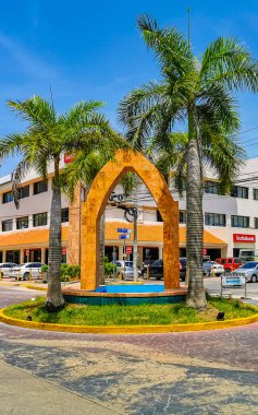Playa del Carmen Quintana Roo Mexico 12. July 2021 Tourist street road with traffic circle and tropical palms palm trees in Playa del Carmen Quintana Roo Mexico.