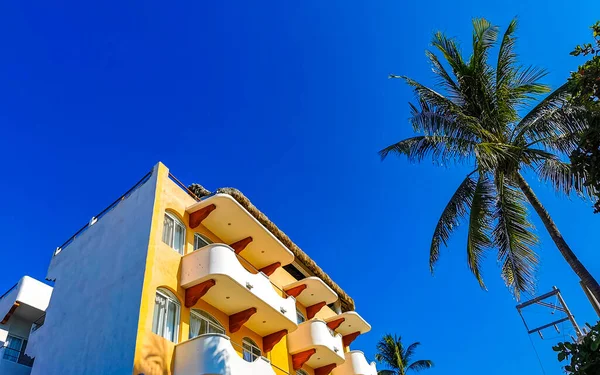 Hotels resorts and buildings in paradise among palm trees in Zicatela Puerto Escondido Oaxaca Mexico.