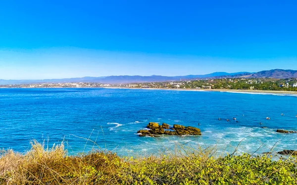 stock image Beautiful tropical and natural city and seascape landscape panorama view with pacific ocean sea palms palm trees and beach with waves of Zicatela Puerto Escondido Oaxaca Mexico.