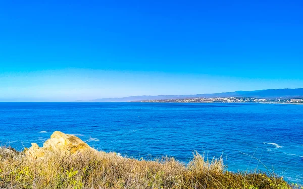 stock image Beautiful tropical and natural city and seascape landscape panorama view with pacific ocean sea palms palm trees and beach with waves of Zicatela Puerto Escondido Oaxaca Mexico.