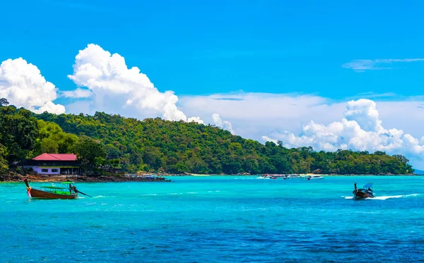 stock image Koh Phi Phi Krabi Thailand 21. October 2018 Longtail boat boats at the beautiful famous beach lagoon between limestone rocks and turquoise water on Koh Phi Phi Don island in Ao Nang Amphoe Mueang Krabi Thailand in Southeast Asia.