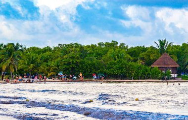 Tropical caribbean beach landscape panorama with clear turquoise blue water in Playa del Carmen Mexico.