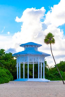 White noble pergula pavilion in paradise on the beach with palm trees in Playa del Carmen Quintana Roo Mexico.