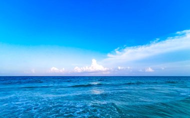 Tropical caribbean beach landscape panorama with clear turquoise blue water in Playa del Carmen Mexico.