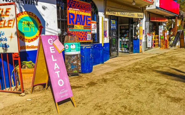 stock image Puerto Escondido Oaxaca Mexico 27. January 2023 Typical colorful tourist street with people tourist shops stores restaurants cars and bar in La Punta in Zicatela Puerto Escondido Oaxaca Mexico.