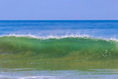 Extremely huge big powerful surfer waves on the beach in Zicatela Puerto Escondido Oaxaca Mexico.