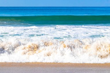 Extremely huge big powerful surfer waves on the beach in Zicatela Puerto Escondido Oaxaca Mexico.
