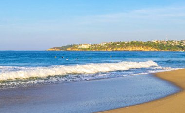 Extremely huge big powerful surfer waves on the beach in Zicatela Puerto Escondido Oaxaca Mexico.