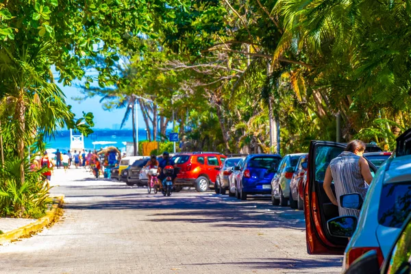 Playa del Carmen 26. March 2021 Typical street road and cityscape with cars traffic restaurants shops stores people and buildings of Playa del Carmen in Quintana Roo Mexico.
