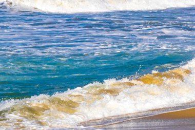 Extremely huge big powerful surfer waves on the beach in Zicatela Puerto Escondido Oaxaca Mexico.