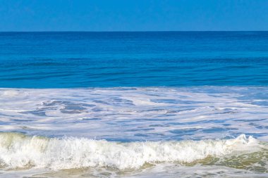 Extremely huge big powerful surfer waves on the beach in Zicatela Puerto Escondido Oaxaca Mexico.