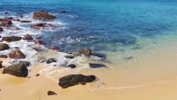 Beach Sand Turquoise Blue Water Rocks Cliffs Boulders Palm Trees — Stock Video