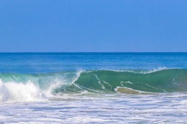 Extremely huge big powerful surfer waves on the beach in Zicatela Puerto Escondido Oaxaca Mexico.