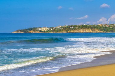 Extremely huge big powerful surfer waves on the beach in Zicatela Puerto Escondido Oaxaca Mexico.