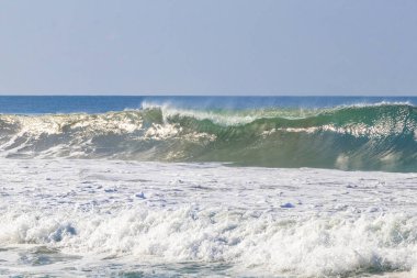 Extremely huge big powerful surfer waves on the beach in Zicatela Puerto Escondido Oaxaca Mexico.