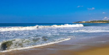 Extremely huge big powerful surfer waves on the beach in Zicatela Puerto Escondido Oaxaca Mexico.