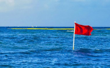 Red flag swimming prohibited high waves in Playa del Carmen Quintana Roo Mexico.