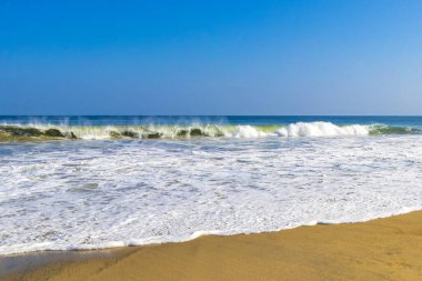 Extremely huge big powerful surfer waves on the beach in Zicatela Puerto Escondido Oaxaca Mexico.