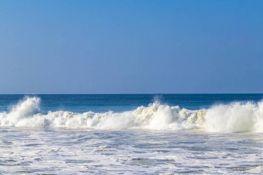 Extremely huge big powerful surfer waves on the beach in Zicatela Puerto Escondido Oaxaca Mexico.