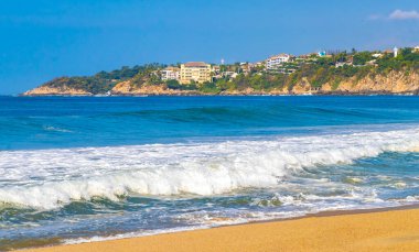 Extremely huge big powerful surfer waves on the beach in Zicatela Puerto Escondido Oaxaca Mexico.