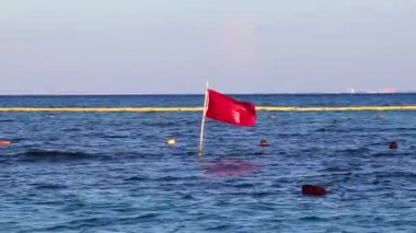 Red flag swimming prohibited high waves in Playa del Carmen Quintana Roo Mexico.