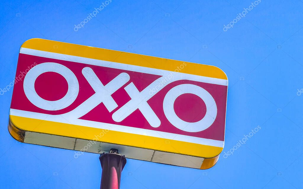 Puerto Escondido Oaxaca Mexico 01. February 2023 Oxxo supermarket logo and blue cloudy sky in Zicatela Puerto Escondido Oaxaca Mexico.