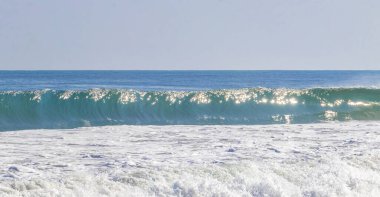 Extremely huge big powerful surfer waves on the beach in Zicatela Puerto Escondido Oaxaca Mexico.