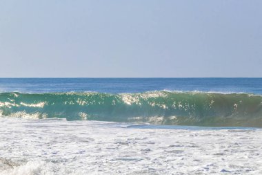 Extremely huge big powerful surfer waves on the beach in Zicatela Puerto Escondido Oaxaca Mexico.
