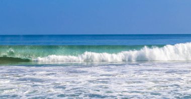 Extremely huge big powerful surfer waves on the beach in Zicatela Puerto Escondido Oaxaca Mexico.