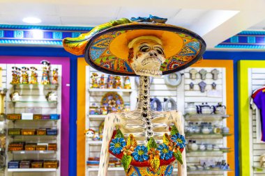 Mexico City Mexico 06. February 2021 Colorful skeletons and skulls souvenirs in the store in Penon de los Banos Venustiano Carranza Mexico City Mexico. clipart