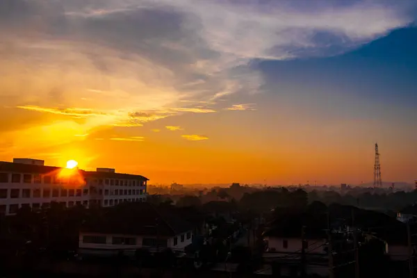 Beautiful golden colorful sunrise over the city panorama in Pattaya Bang Lamung Amphoe Chon Buri Thailand in Southeastasia Asia.