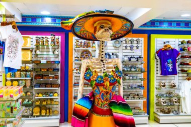 Mexico City Mexico 06. February 2021 Colorful skeletons and skulls souvenirs in the store in Penon de los Banos Venustiano Carranza Mexico City Mexico. clipart