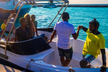 23. February 2018 Rasdhoo Rasdhoo Atoll Maldives People tourist group with speedboat in the blue turquoise water on Rasdhoo island in Rasdhoo Atoll Maldives.