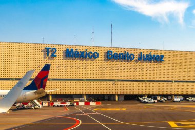 Aircraft at the airport Building and runway Aeropuerto Internacional Benito Juarez in Penon de los Banos Venustiano Carranza Mexico City Mexico. clipart