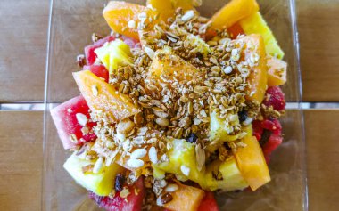 Breakfast at the restaurant with fruits fruit salad with oatmeal in Zicatela Puerto Escondido Mexico.