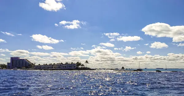 stock image Isla Mujeres Womens Island panorama view from speed boat to tropical beach pier jetty resorts hotels boats people and palm trees in Caribbean Sea Cancun Quintana Roo Mexico.