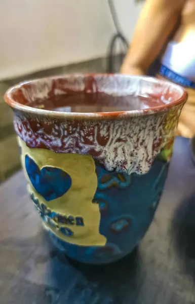 Stock image Glass or cup pot with hot ginger tea on a wooden table in Playa del Carmen Mexico.