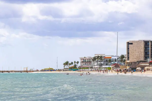 stock image Tropical mexican caribbean beach and sea with a lot of fun people sun loungers parasols turquoise water hotels resorts in Playa del Carmen Mexico.