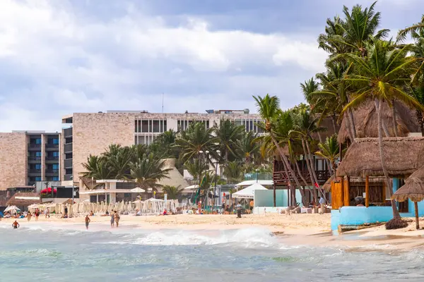 stock image Tropical mexican caribbean beach and sea with a lot of fun people sun loungers parasols turquoise water hotels resorts in Playa del Carmen Mexico.