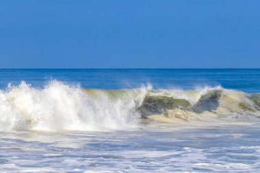 Extremely huge big powerful surfer waves on the beach in Zicatela Puerto Escondido Oaxaca Mexico.