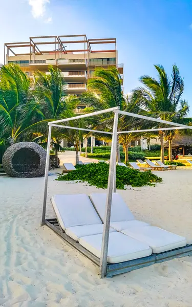 stock image Tropical mexican caribbean beach and sea with people sun loungers parasols resort turquoise water and waves in Playa del Carmen Quintana Roo Mexico.