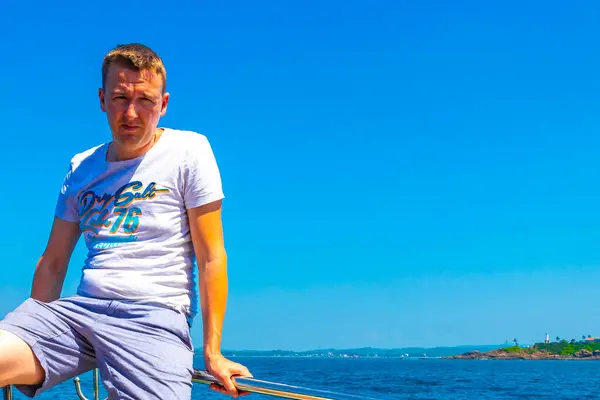 stock image Man tourist traveler on boat trip catamaran ship tour blue whale tourists people and sea ocean and water in Mirissa Beach Matara District Southern Province Sri Lanka.