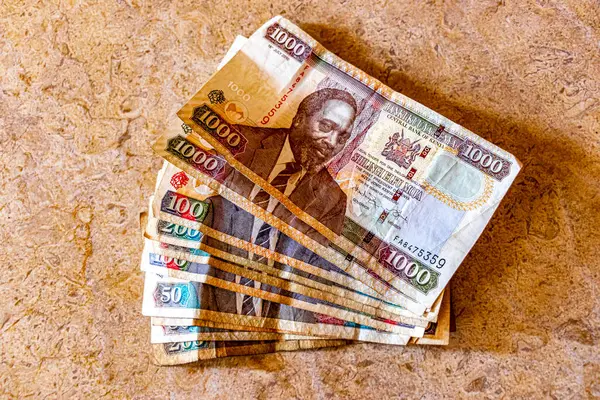 stock image 1000 200 100 and 50 bill Kenya shilling money in Africa on a wooden table.